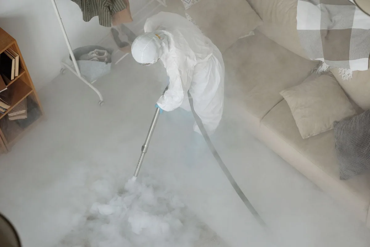 Biohazard cleanup technician in protective equipment, Gardiner, ME